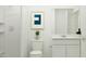 Clean bathroom featuring a shower, toilet, white vanity, and modern finishes at 36570 W Maddaloni Ave, Maricopa, AZ 85138
