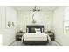 Stylish bedroom featuring dinosaur-themed decor, patterned walls, and natural light at 36570 W Maddaloni Ave, Maricopa, AZ 85138