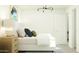 Bright bedroom featuring stylish decor, ample natural light, and modern lighting at 36570 W Maddaloni Ave, Maricopa, AZ 85138