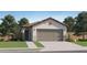 Charming single-story home with a tile roof, neutral stucco, and a two-car garage at 36570 W Maddaloni Ave, Maricopa, AZ 85138