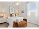 Cozy bedroom with stylish decor, modern lighting, and comfortable furnishings at 46392 W Lander Ln, Maricopa, AZ 85139