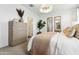 Cozy bedroom featuring soft lighting, neutral decor, and stylish furnishings for a relaxing atmosphere at 46392 W Lander Ln, Maricopa, AZ 85139