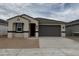 Charming single-story home with a two-car garage and a neutral color palette at 46392 W Lander Ln, Maricopa, AZ 85139