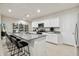 Bright kitchen features gray granite countertops, white cabinetry and stainless steel appliances at 46395 W Lander Ln, Maricopa, AZ 85139