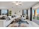 The stylish living room is decorated in neutral colors and provides plenty of seating at 46395 W Lander Ln, Maricopa, AZ 85139
