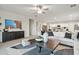 Bright and spacious open-concept living room with stylish decor and plenty of natural light at 46395 W Lander Ln, Maricopa, AZ 85139