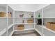 Walk-in pantry with multiple shelves for storing food and small appliances at 46395 W Lander Ln, Maricopa, AZ 85139