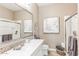 Bright bathroom with a single sink vanity, a large mirror, and a tiled shower at 4777 S Fulton Ranch Blvd # 1032, Chandler, AZ 85248
