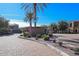 Inviting Serenity Shores entrance with mature landscaping, American flags, and stone monument at 4777 S Fulton Ranch Blvd # 1032, Chandler, AZ 85248