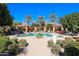Upscale community pool with well-placed lounge chairs and cabanas, surrounded by lush palm trees and landscaping at 4777 S Fulton Ranch Blvd # 1032, Chandler, AZ 85248