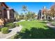 Community green space with manicured lawn, mature trees, and beautiful landscaping at 4777 S Fulton Ranch Blvd # 1032, Chandler, AZ 85248