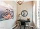 Stylish home office featuring a black desk, vibrant artwork, and modern decor with natural light from a window at 4777 S Fulton Ranch Blvd # 1032, Chandler, AZ 85248