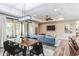 Open-concept space with wood floors, a dining table, and a comfortable seating area with a large sectional sofa at 4777 S Fulton Ranch Blvd # 1032, Chandler, AZ 85248