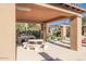 Outdoor community kitchen with a built-in grill, picnic table, and pergola providing a relaxed gathering spot at 4777 S Fulton Ranch Blvd # 1032, Chandler, AZ 85248