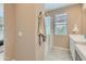 Stylish bathroom with glass-enclosed shower, neutral color palette, and modern fixtures at 4975 S 233Rd Dr, Buckeye, AZ 85326