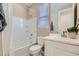Bright bathroom with a tub, toilet, modern vanity, and updated fixtures at 4975 S 233Rd Dr, Buckeye, AZ 85326