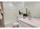 Clean bathroom with a tub shower combo, a vanity, and updated fixtures at 4975 S 233Rd Dr, Buckeye, AZ 85326
