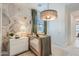 Charming Bedroom featuring stylish decor, modern crib, and plenty of natural light at 4975 S 233Rd Dr, Buckeye, AZ 85326