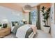 Bright bedroom featuring a woven light fixture, stylish decor, a yoga sign, and a serene, peaceful atmosphere at 4975 S 233Rd Dr, Buckeye, AZ 85326