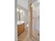 Bathroom featuring tile flooring, tiled walk-in shower, and classic vanity with sink at 530 E Draper St, Mesa, AZ 85203