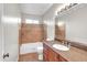 Bathroom featuring tile accents in shower and granite countertops at 530 E Draper St, Mesa, AZ 85203