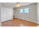 Bedroom featuring hardwood flooring, large windows and a built-in desk area at 530 E Draper St, Mesa, AZ 85203