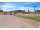 Exterior view of a single-story home with a driveway, lawn, and a one car garage at 530 E Draper St, Mesa, AZ 85203