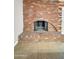 Brick fireplace with tile base and arch in the living room at 530 E Draper St, Mesa, AZ 85203
