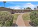 Front yard of a single-story home with a walkway, manicured lawn, and desert landscaping at 530 E Draper St, Mesa, AZ 85203