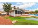 Well-maintained backyard with putting green and patio at 5407 W North Ln, Glendale, AZ 85302