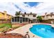 Large backyard with pool, grass, and detached sunroom at 5407 W North Ln, Glendale, AZ 85302