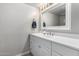 Clean bathroom featuring a large mirror, ample counter space, and a bright, neutral color scheme that enhances comfort at 5407 W North Ln, Glendale, AZ 85302
