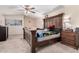 Comfortable bedroom featuring a ceiling fan, large windows, and neutral tones for a calming and relaxing environment at 5407 W North Ln, Glendale, AZ 85302