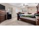 Cozy bedroom features a ceiling fan and neutral tones creating a serene and inviting atmosphere for rest and relaxation at 5407 W North Ln, Glendale, AZ 85302