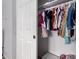 Closet featuring hanging clothes, a white door, and a white interior at 5407 W North Ln, Glendale, AZ 85302