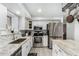 Stylish kitchen with stainless steel appliances and granite countertops provides a functional and appealing cooking space at 5407 W North Ln, Glendale, AZ 85302