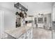 Spacious eat in kitchen features a center island, stainless appliances, and bright natural light, perfect for Gathering meals at 5407 W North Ln, Glendale, AZ 85302