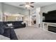 Spacious open-concept living room featuring carpet flooring and vaulted ceilings at 5407 W North Ln, Glendale, AZ 85302