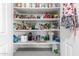 Organized pantry with lots of shelving and storage ensures a clutter-free and efficient space for kitchen supplies at 5407 W North Ln, Glendale, AZ 85302
