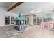 Open sunroom with tile flooring, ceiling fans and abundant natural light at 5407 W North Ln, Glendale, AZ 85302