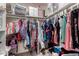 Walk-in closet features custom shelving, hanging racks, and ample storage space at 5407 W North Ln, Glendale, AZ 85302