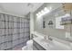 Bathroom featuring neutral paint, decorative shower curtain, sink, and mirror at 633 W Southern Ave # 1131, Tempe, AZ 85282
