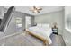 Light-filled bedroom featuring neutral tones, ensuite bathroom and a ceiling fan at 633 W Southern Ave # 1131, Tempe, AZ 85282