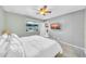 Bedroom with a window, ceiling fan and ensuite bathroom at 633 W Southern Ave # 1131, Tempe, AZ 85282