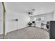 Large bedroom with soft carpet, ceiling fan, and natural light from the window at 633 W Southern Ave # 1131, Tempe, AZ 85282