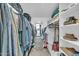 Spacious walk-in closet with storage shelves and access to bathroom at 633 W Southern Ave # 1131, Tempe, AZ 85282