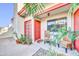 Charming front entrance with red door, desert landscaping, and cozy seating area, perfect for enjoying the outdoors at 633 W Southern Ave # 1131, Tempe, AZ 85282