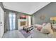 Inviting living room with a stylish brick fireplace, large windows, and comfortable seating, creating a relaxing atmosphere at 633 W Southern Ave # 1131, Tempe, AZ 85282
