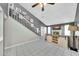 Bright living room featuring modern staircase, TV, fireplace, and tiled flooring at 633 W Southern Ave # 1131, Tempe, AZ 85282