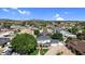 Picturesque neighborhood with single-Gathering homes, lush green trees, and distant mountain views at 645 S 54Th St, Mesa, AZ 85206